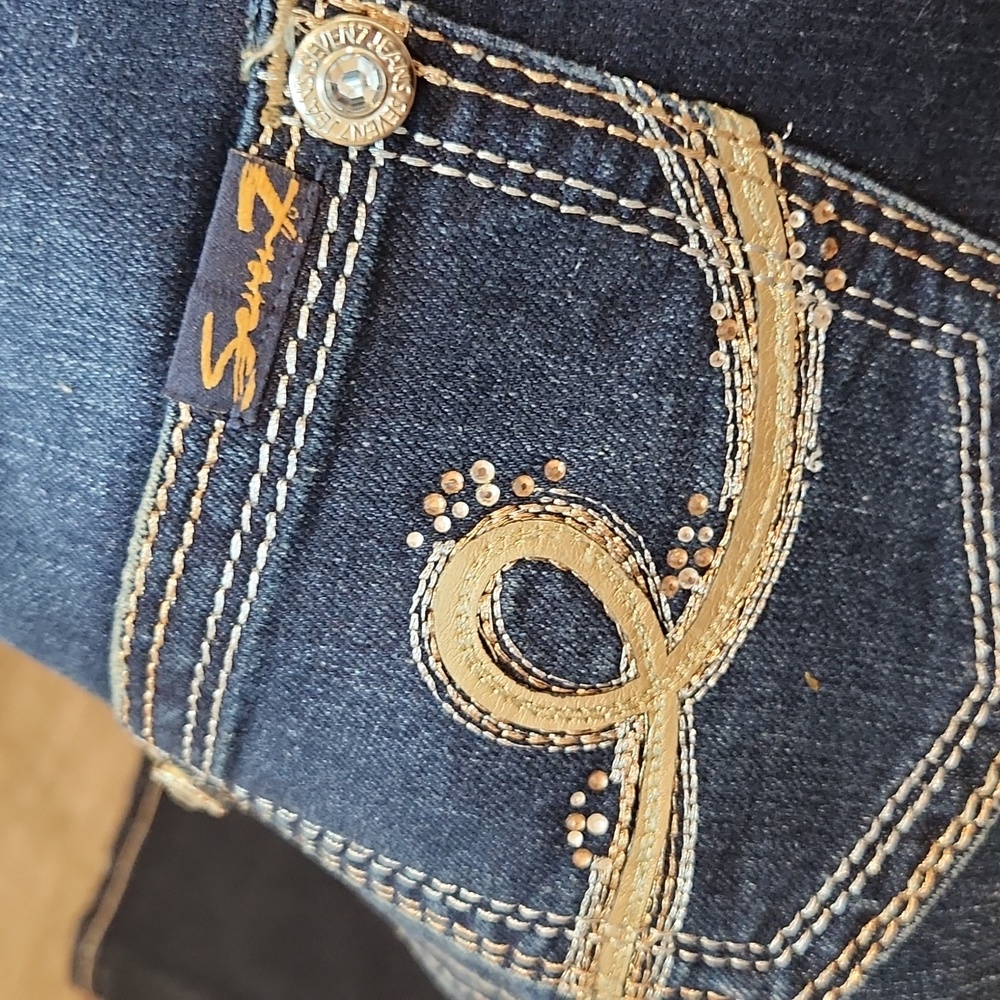 Seven 7 Jean's Skinny with rhinestone buttons and gold & silver details. Size 25